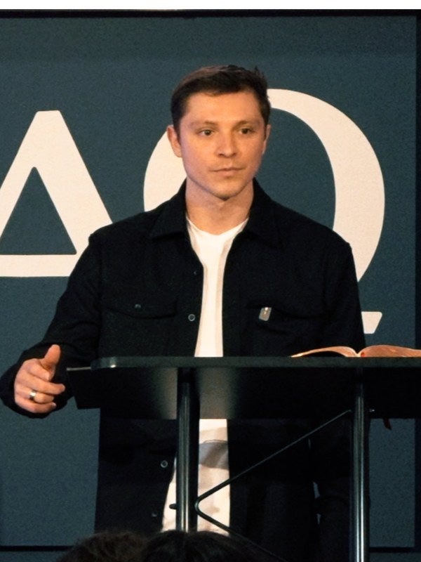 Andrew Ramirez preaching from the Bible